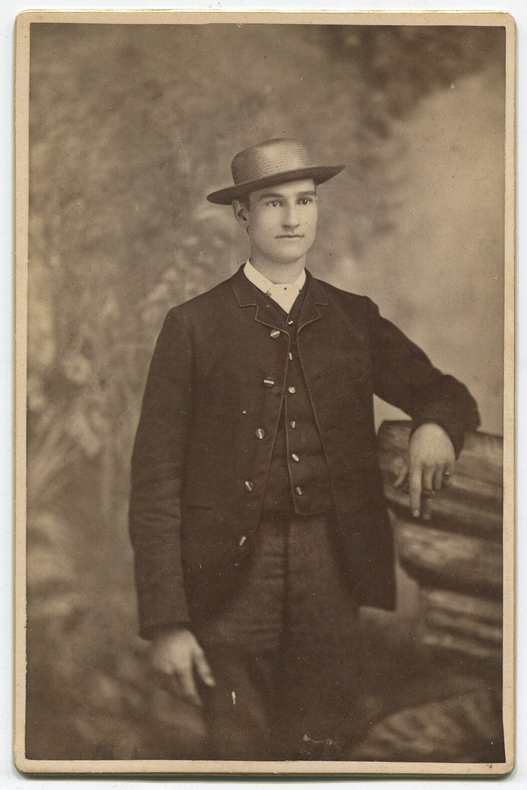 HANDSOME MAN THINKING OF DINNER. MAN IN 3 PIECE SUIT, STRAW HAT. CABINET CARD.