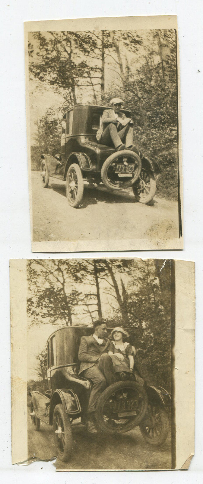 COUPLE SEATED ON BACK OF MODEL T CAR. TONED SILVER PRINT. 2 SET.