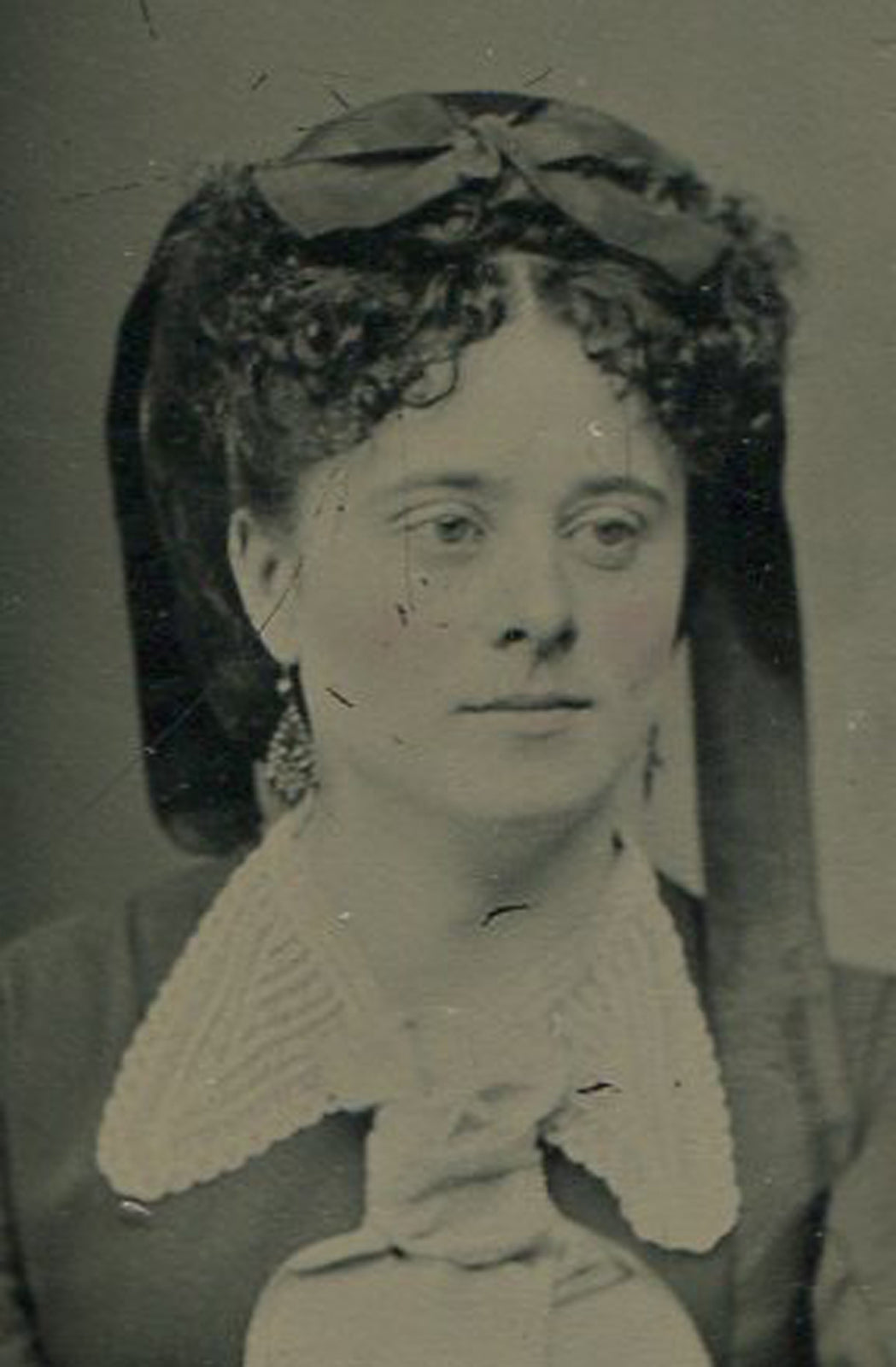 PRETTY WOMAN WITH HORRIBLE HEAD COVERING. TINTED TINTYPE.