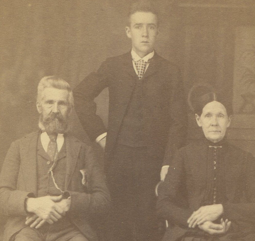 Vintage cabinet card photo: Parents with adult son, humorous mooching theme,