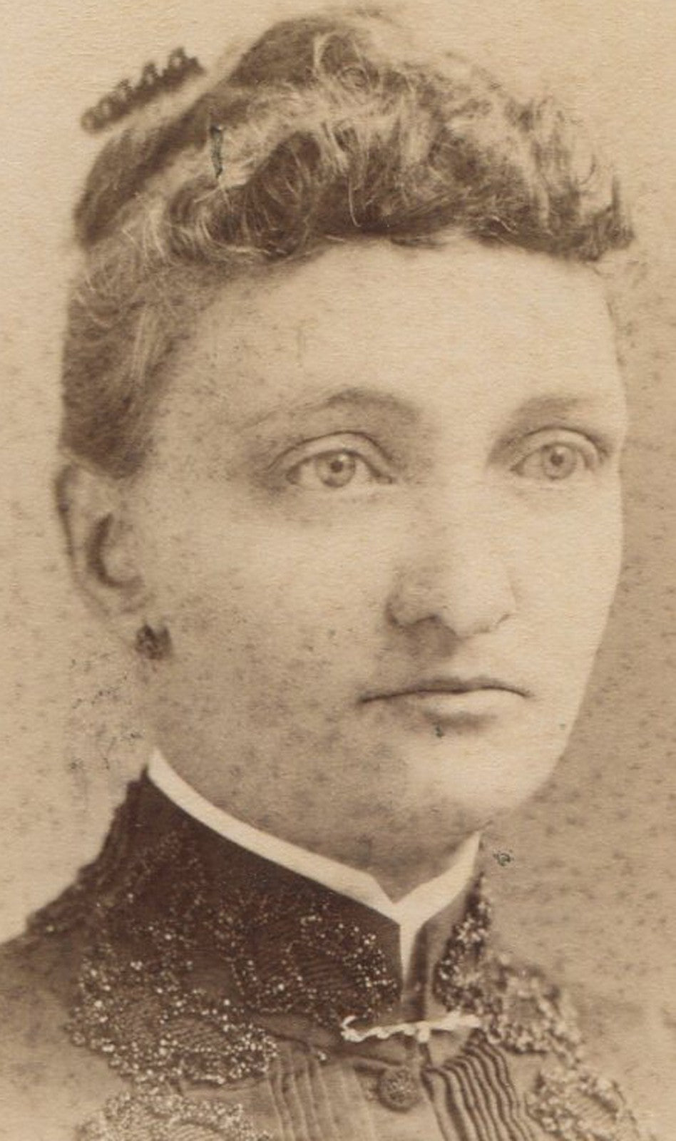 Vintage cabinet card portrait, woman with blank stare, Newark NJ, earrings, wall