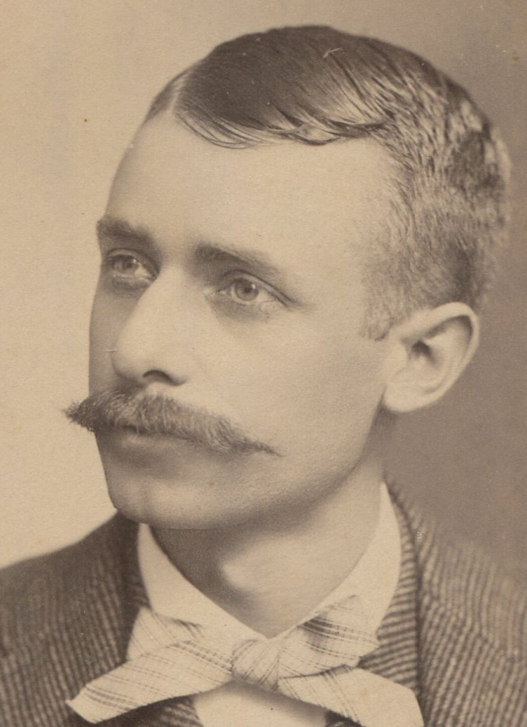 Vintage cabinet card portrait: mustached man with bow tie, Columbus, Ohio