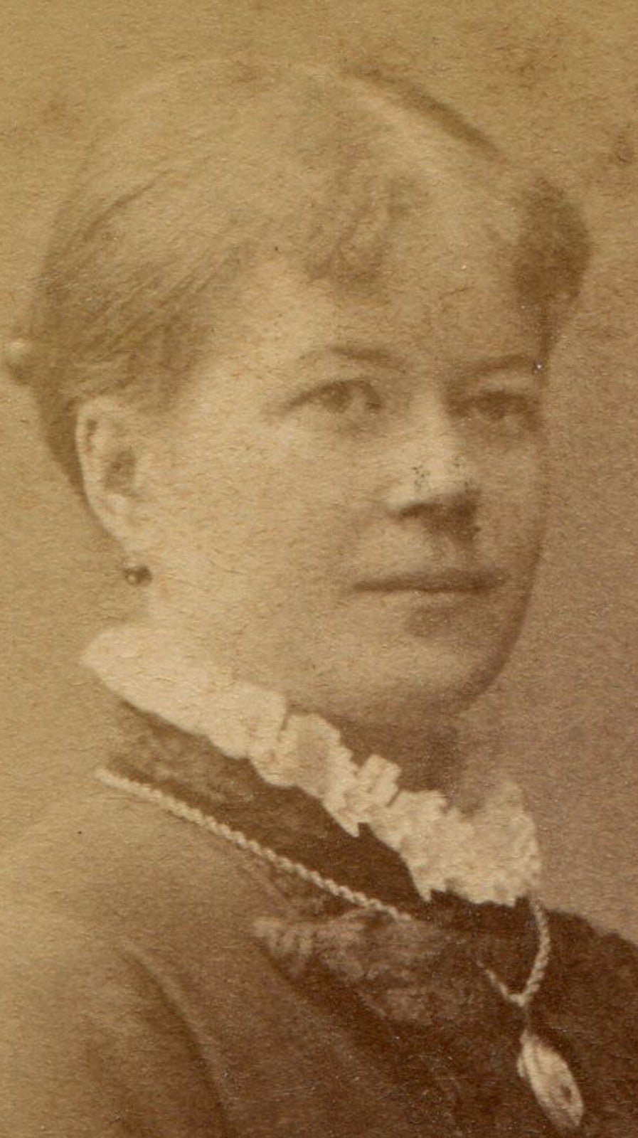 WOMAN, STATELY POSE, HANDS AT REST ON CHAIR. CDV. STOCKHOLM, SWEDEN.