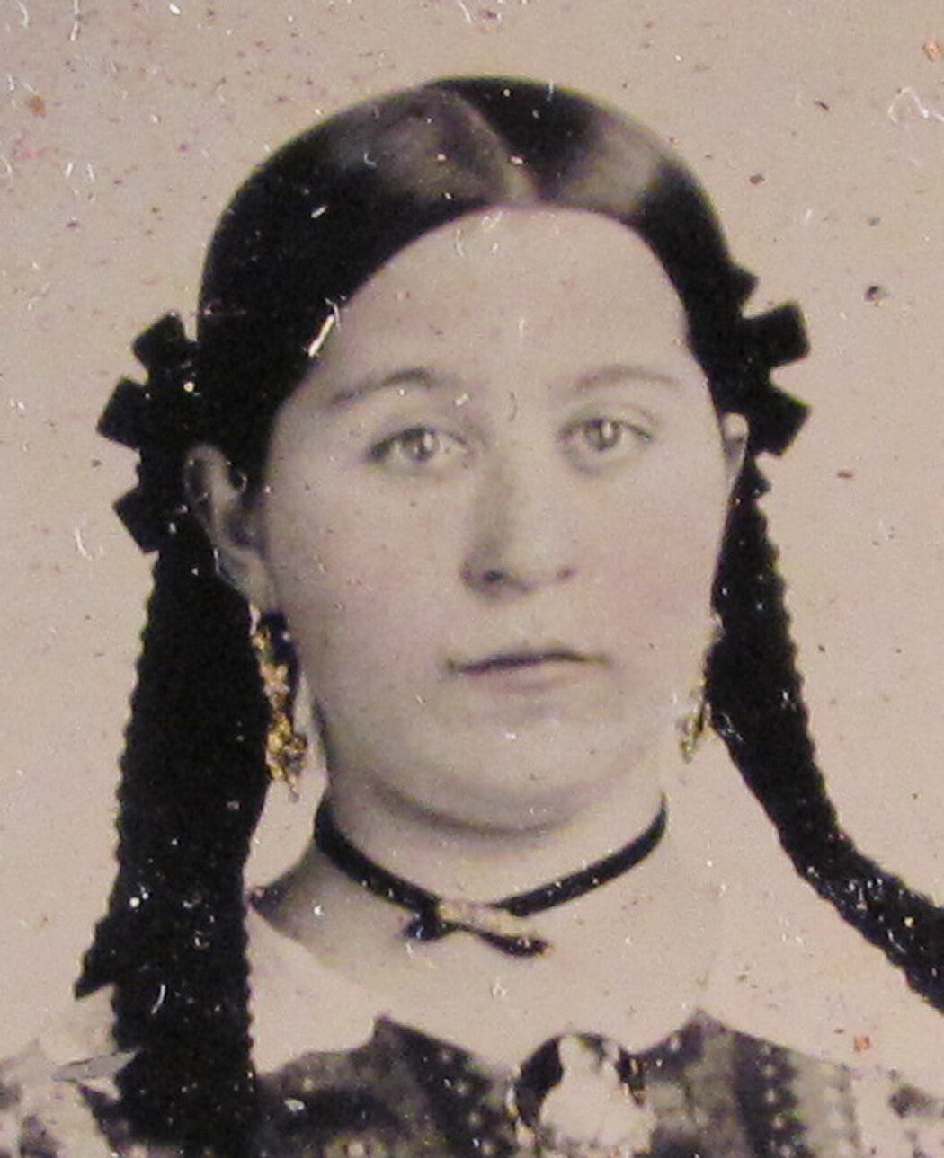 GIRL IN PIGTAILS, LOUD PATTERNED DRESS. 9TH PLATE TINTED TINTYPE, HALF CASE.