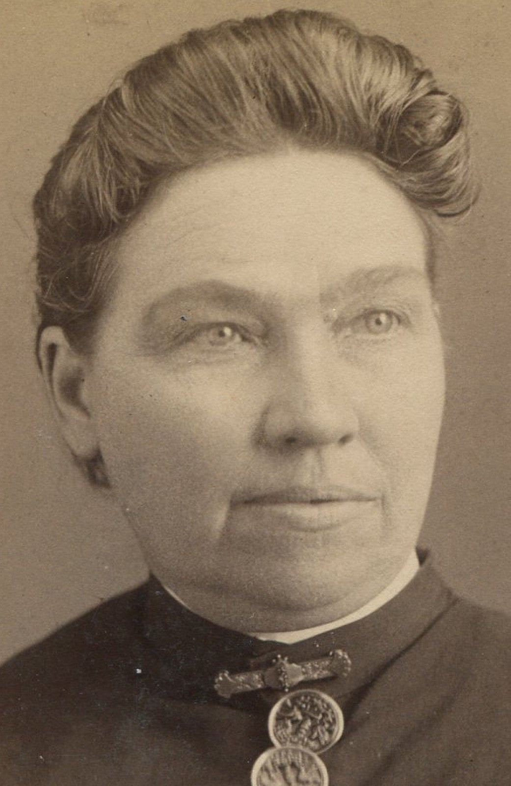 Vintage cabinet card portrait photograph of an older woman in a dress with