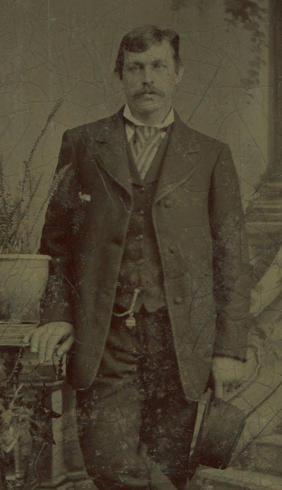 MAN W/ MUSTACHE AND HAT IN HAND. TINTYPE.