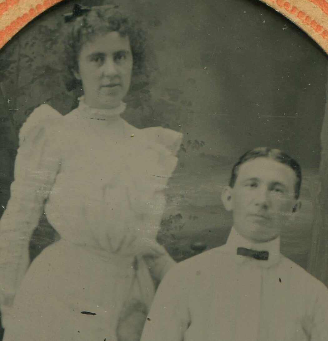 PRIM YOUNG COUPLE, IN ALL WHITE. TINTYPE IN PERIOD PAPER MAT.