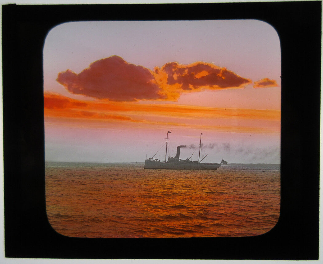 STEAMSHIP, SUNSET N.Y. BAY. PHOTO ON GLASS, HAND COLORED.
