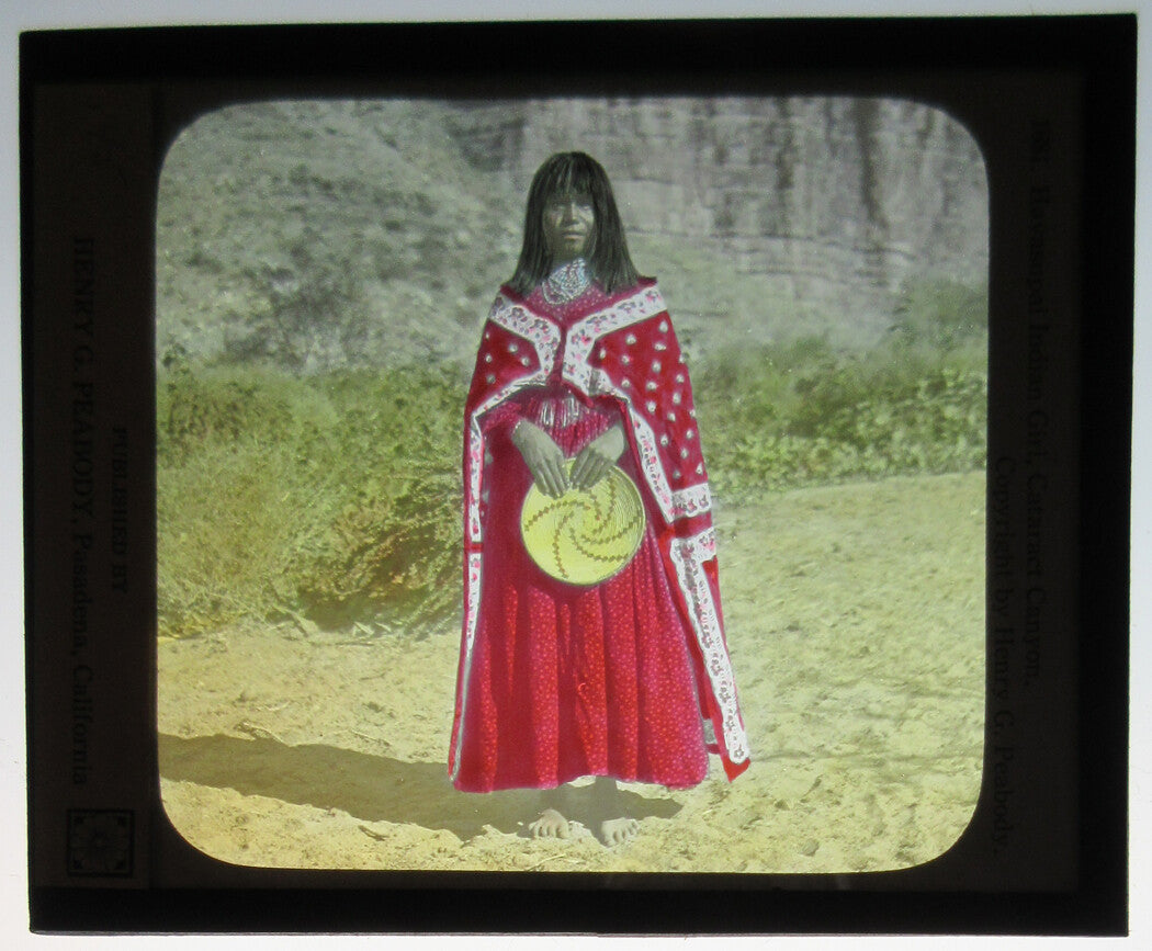 NATIVE WOMAN IN BEAUTIFUL TRADITIONAL DRESS, WEAVING IN HAND. TINTED ON GLASS.