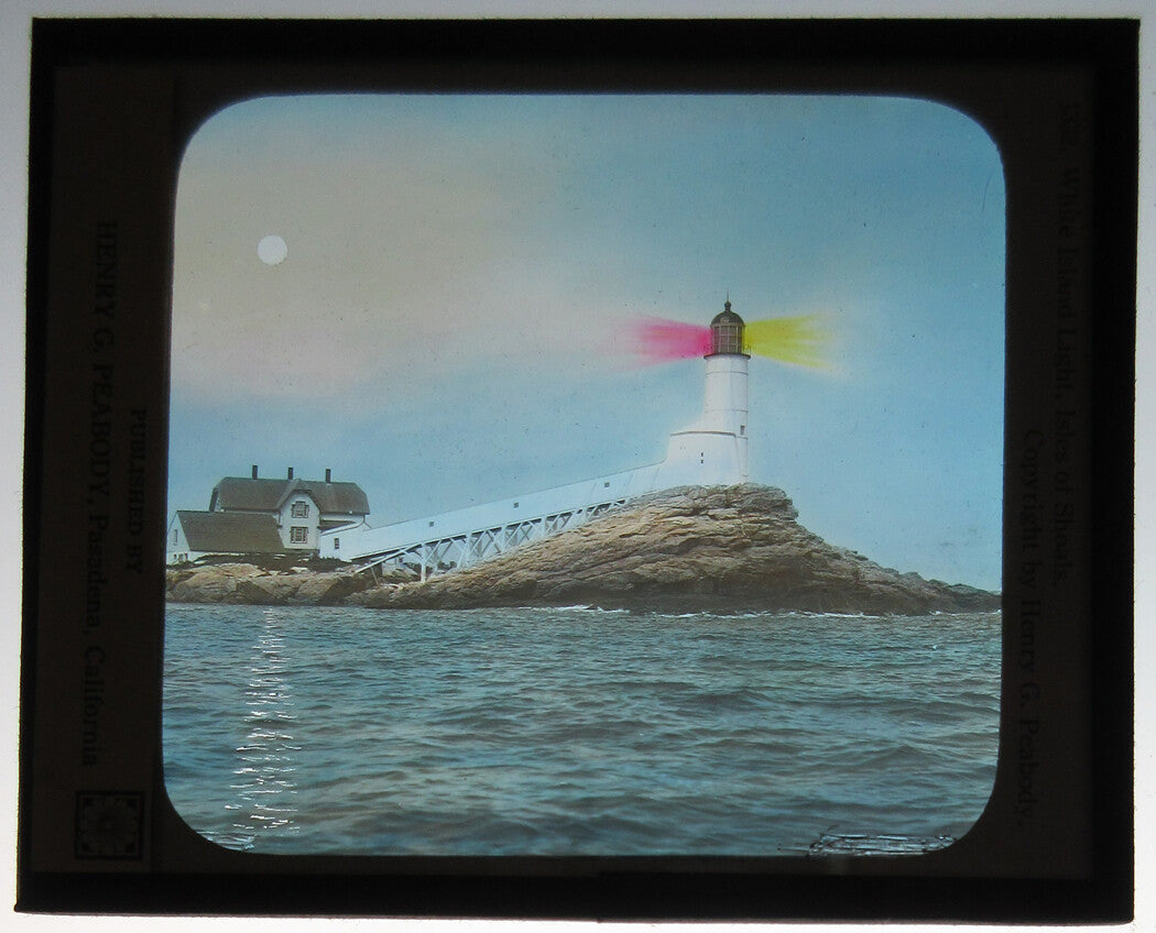 LIGHTHOUSE AT ISLES OF SHOALS. PHOTO ON GLASS, HAND COLORED.