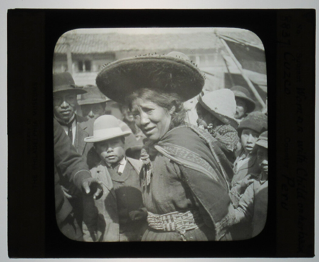 INDIGENOUS WOMAN WITH CHILD ON HER BACK. CUZCO, PERU. PHOTO ON GLASS.