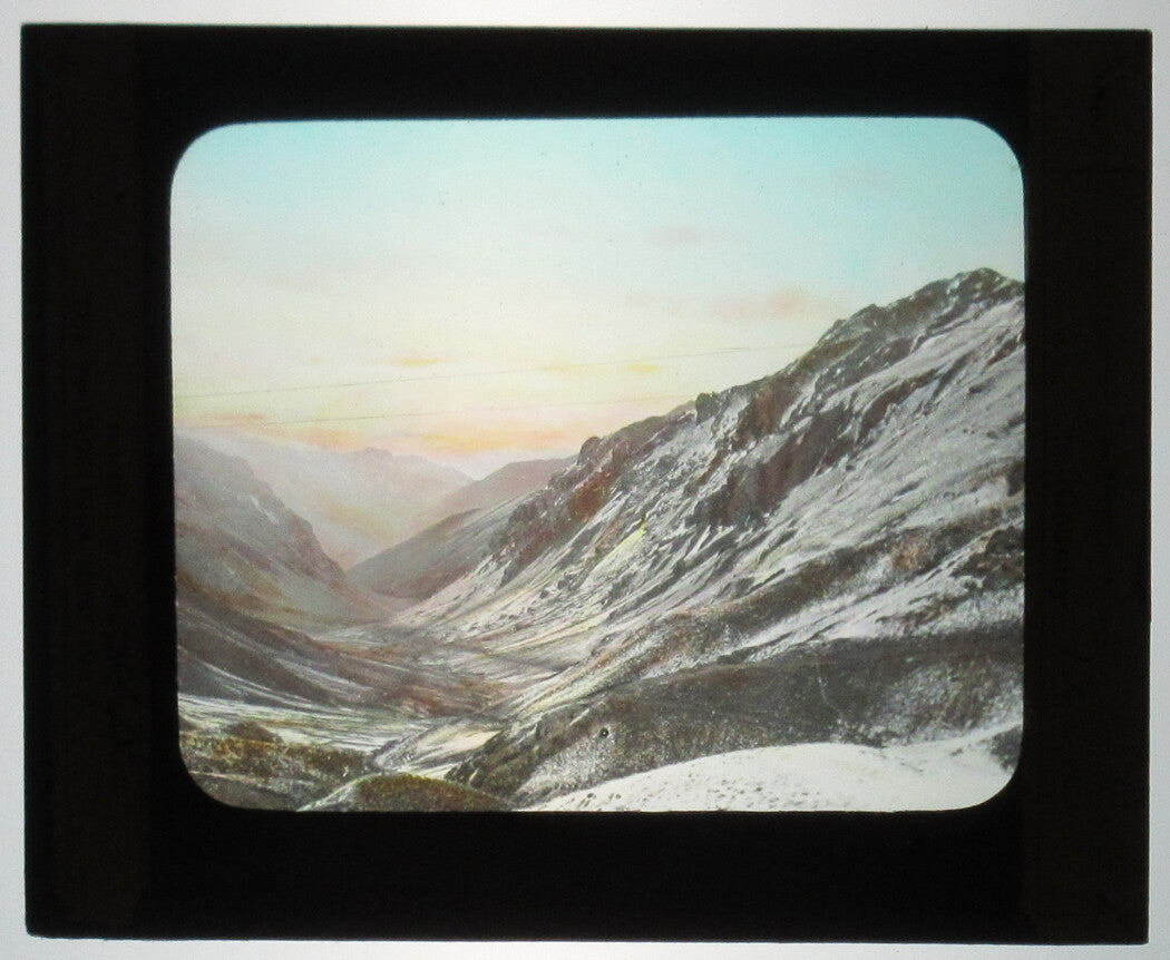 SNOW COVERED MOUNTAIN SLOPES, PERU. TINTED PHOTO ON GLASS.