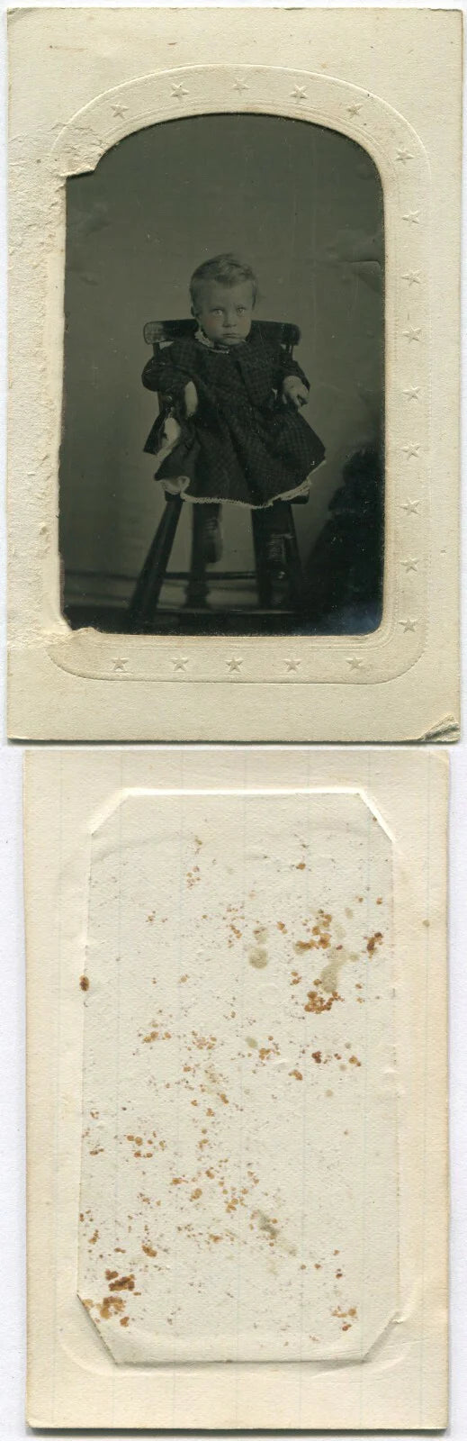 TODDLER LOOKING LIKE AN OPPRESSOR. TINTED TINTYPE IN PAPER MAT.