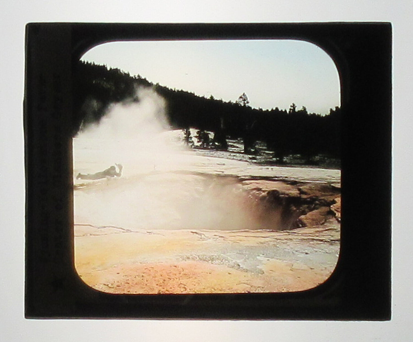 CRATER OF GIANTESS GEYSER. HAND COLORED PHOTO ON GLASS.
