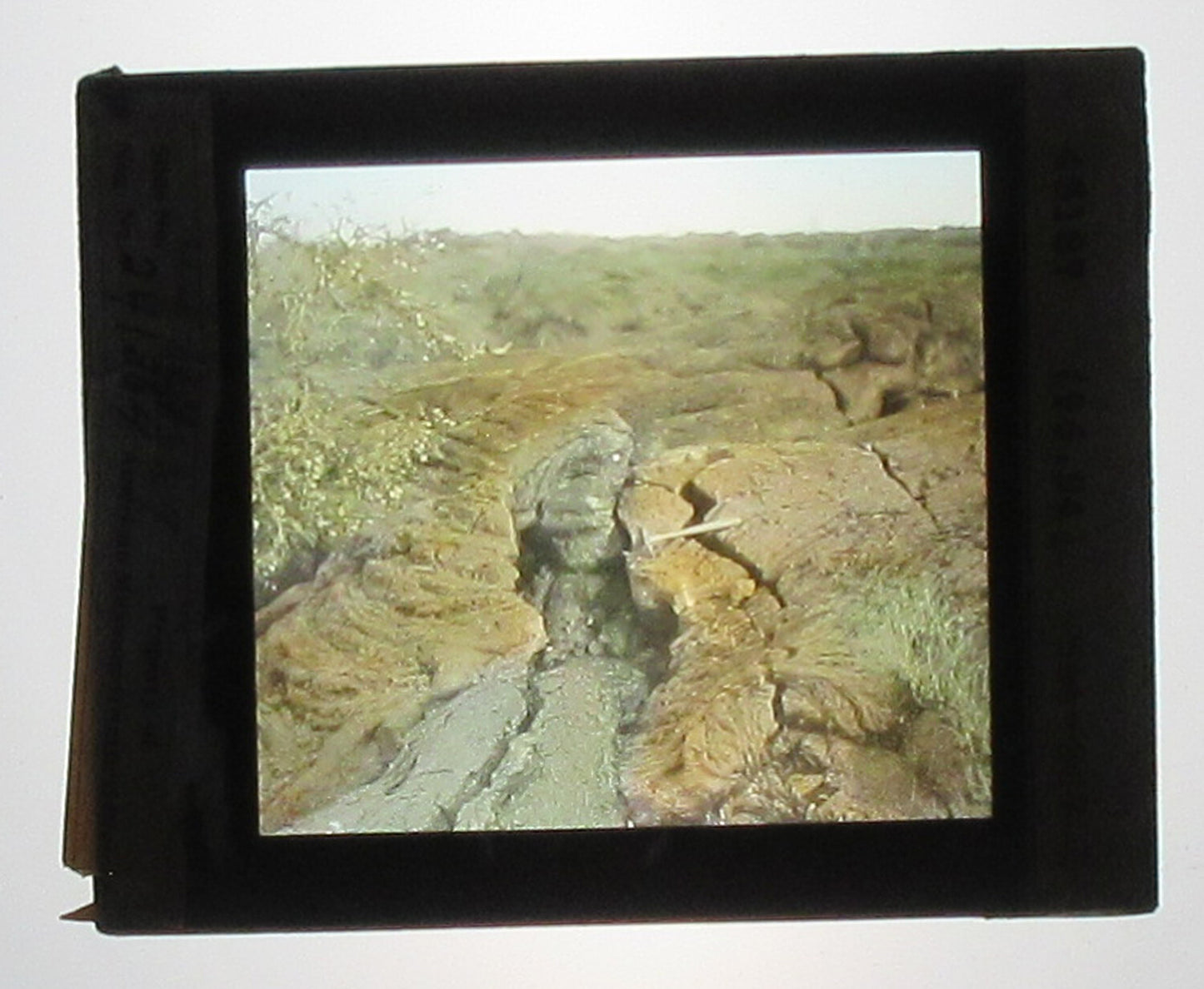 KILAUEA LAVA FLOW. HAND COLORED PHOTO ON GLASS.
