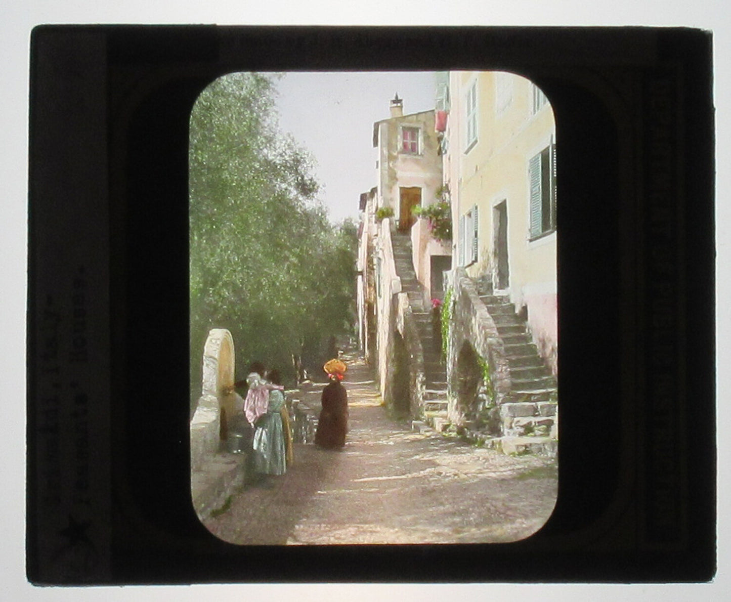 HOUSE IN GRIMALDI, ITALY. HAND COLORED PHOTO ON GLASS. TINTED LANTERN SLIDE.