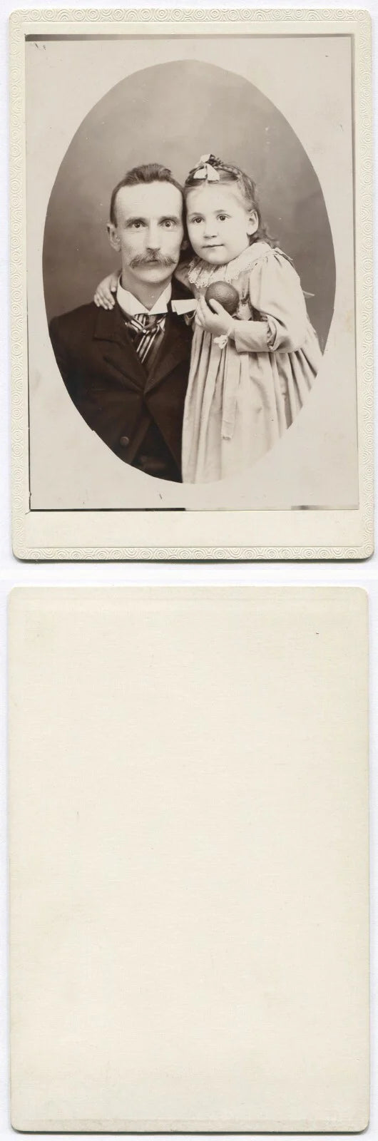FATHER WITH YOUNG DAUGHTER, HOLDING A TOY. CABINET CARD.