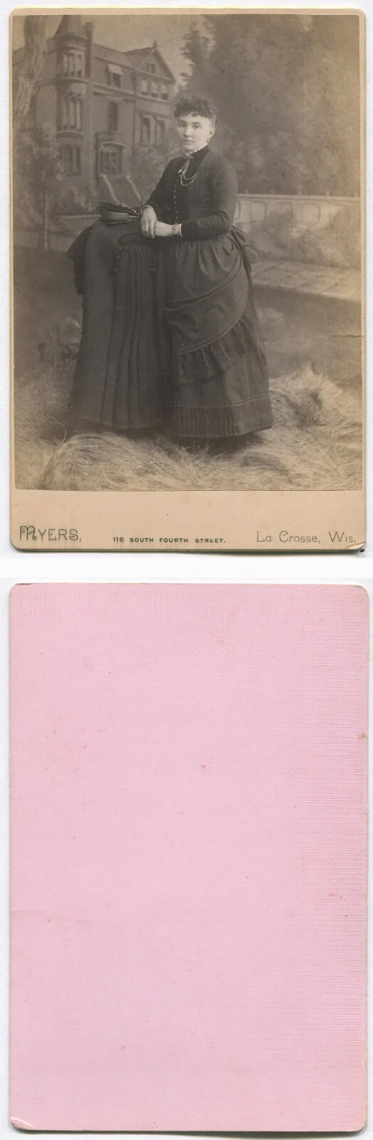 WOMAN POSED W/COAT AND HANDBAG. HOUSE IS PAINTED BACKGROUND. CABINET CARD. WIS.