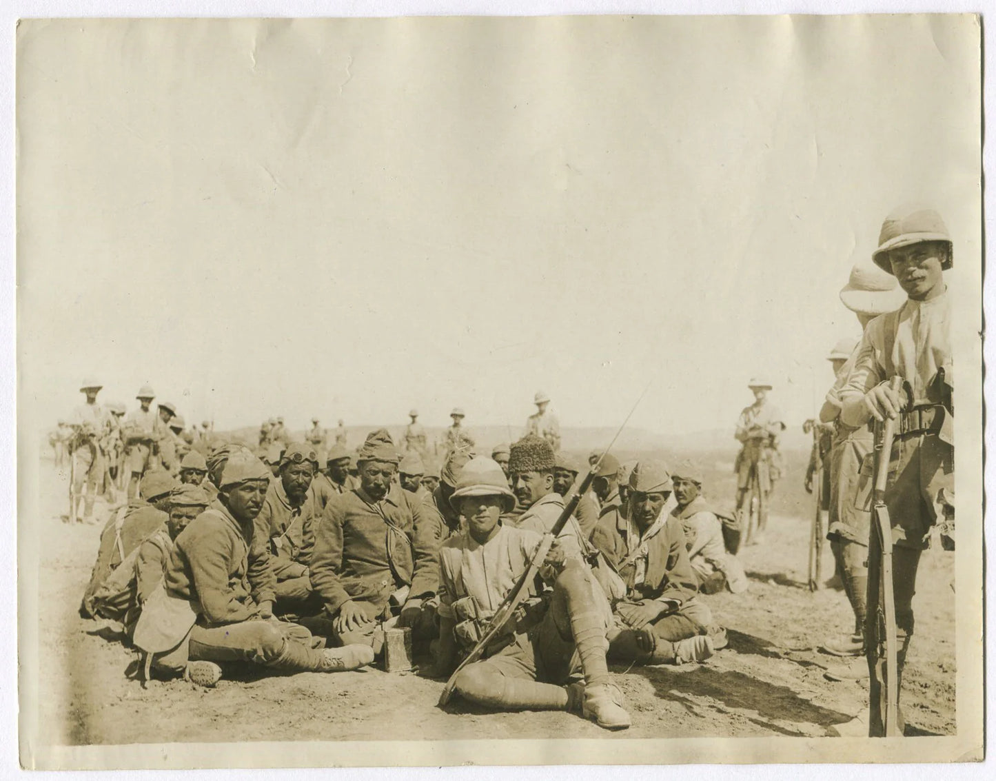 BRITISH TROOPS REST TURKISH PRISONERS ON MARCH TO BAGHDAD. (8x10 REPRINT)