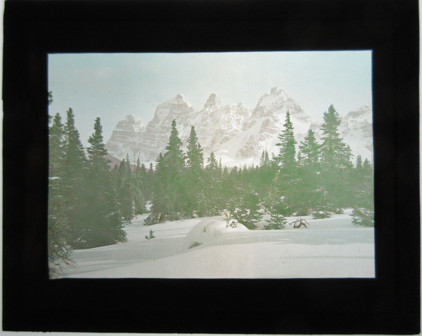 MOUNTAIN WINTER SCENE. HAND TINTED LANTERN SLIDE.