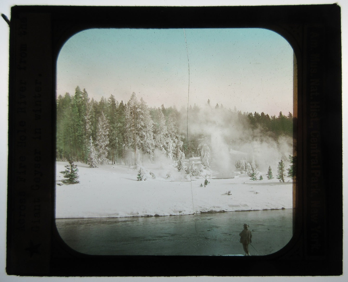 FIRE HOLE RIVER W/GEYSER IN WINTER. HAND COLORED PHOTO ON GLASS.