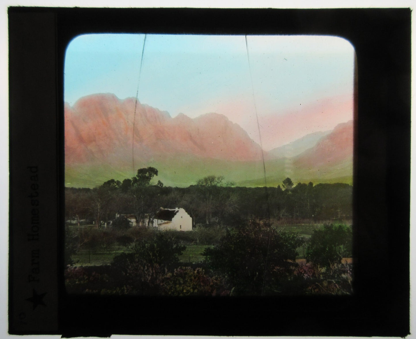 FARM HOUSE, SOUTH AFRICA. HAND COLORED PHOTO ON GLASS.