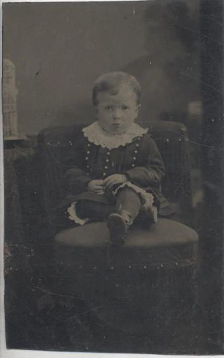 TINTYPE PORTRAIT OF UNUSUALLY DRESSED YOUNG BOY W/ UPSET EXPRESSION