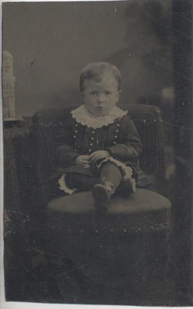 TINTYPE PORTRAIT OF UNUSUALLY DRESSED YOUNG BOY W/ UPSET EXPRESSION