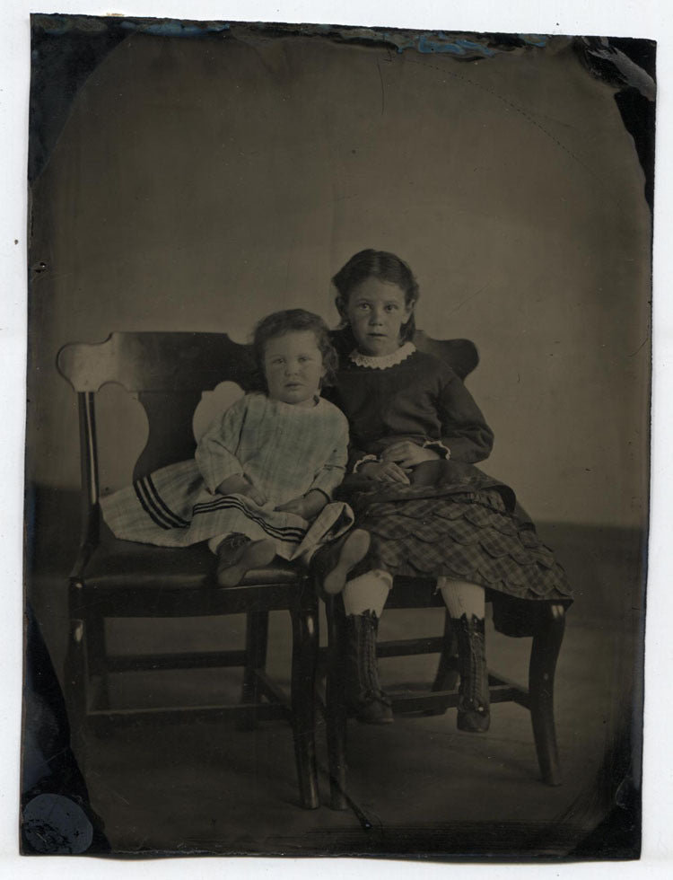 TINTYPE PORTRAIT OF YOUNG SISTERS ON CHAIRS. TINTED, INCREDIBLY SHARP.