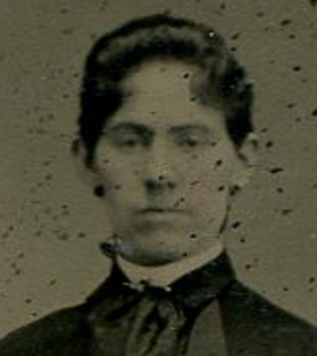 WOMAN POSED AT RUSTIC GATE. TINTED TINTYPE.