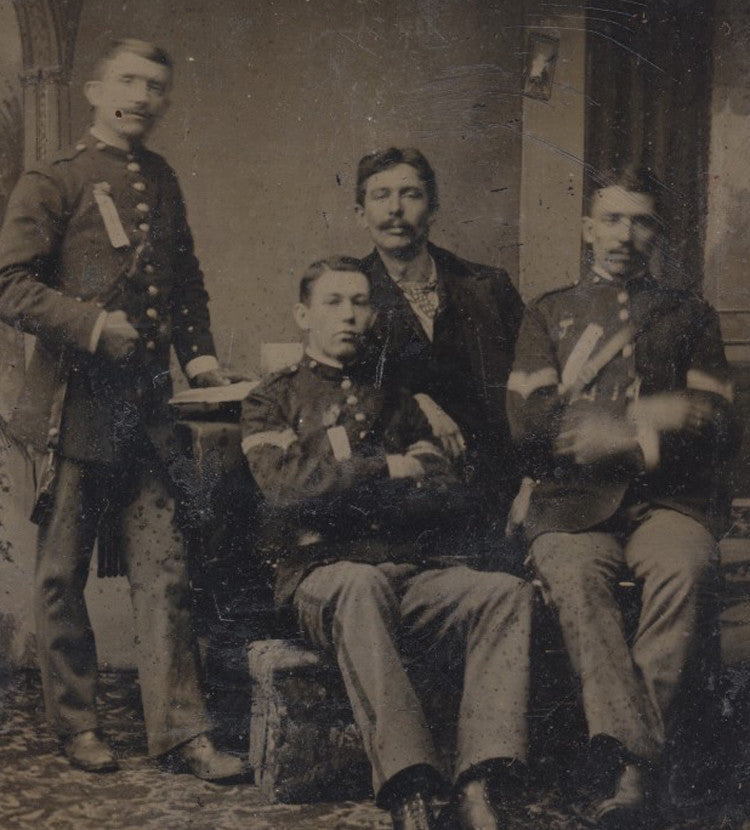 TINTYPE OF FOUR INDIAN WAR SOLDIERS IN UNIFORMS - IN RELAXED POSES