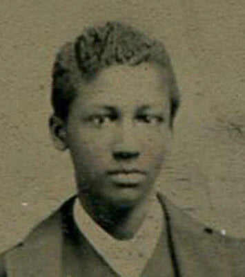 AFRICAN AMERICAN. VERY HANDSOME YOUNG MAN. TINTED TINTYPE. PAINTED BACKGROUND.