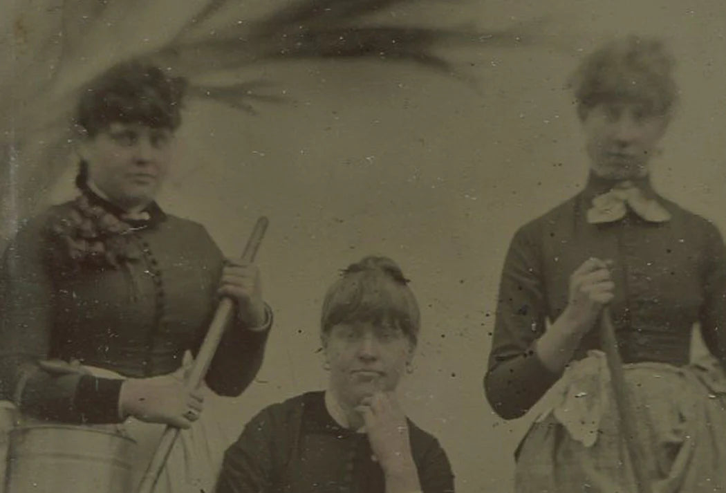 THREE WOMEN POSED WITH FARM TOOLS. TINTYPE.