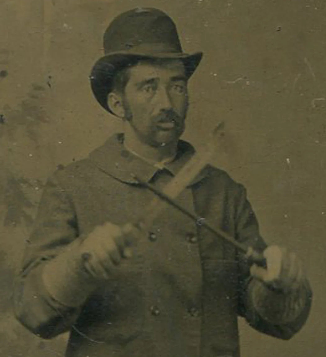 OCCUPATIONAL, BUTCHER SHARPENING KNIFE. TINTYPE IN PERIOD MAT.
