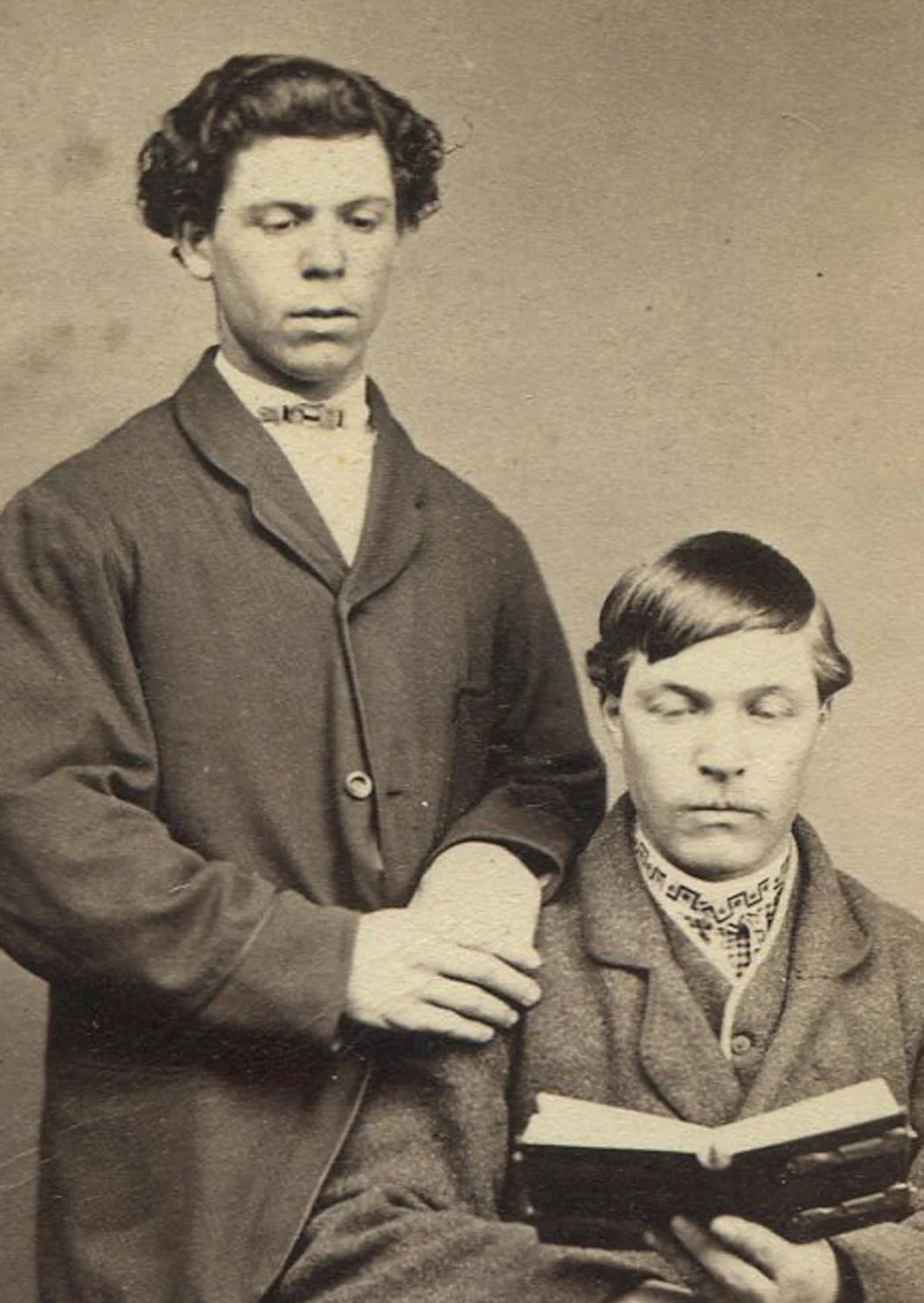 MEN POSED READING BOOK. UNIQUE.