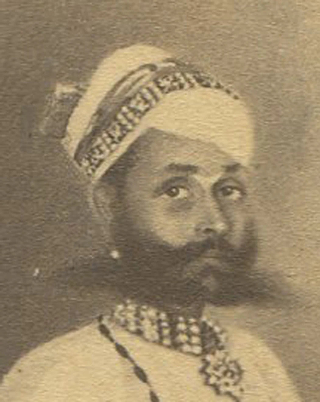 MAN IN TRADITIONAL SETTING. INDIA, 19TH CEN. INDIA. ARTWORK ON CDV.