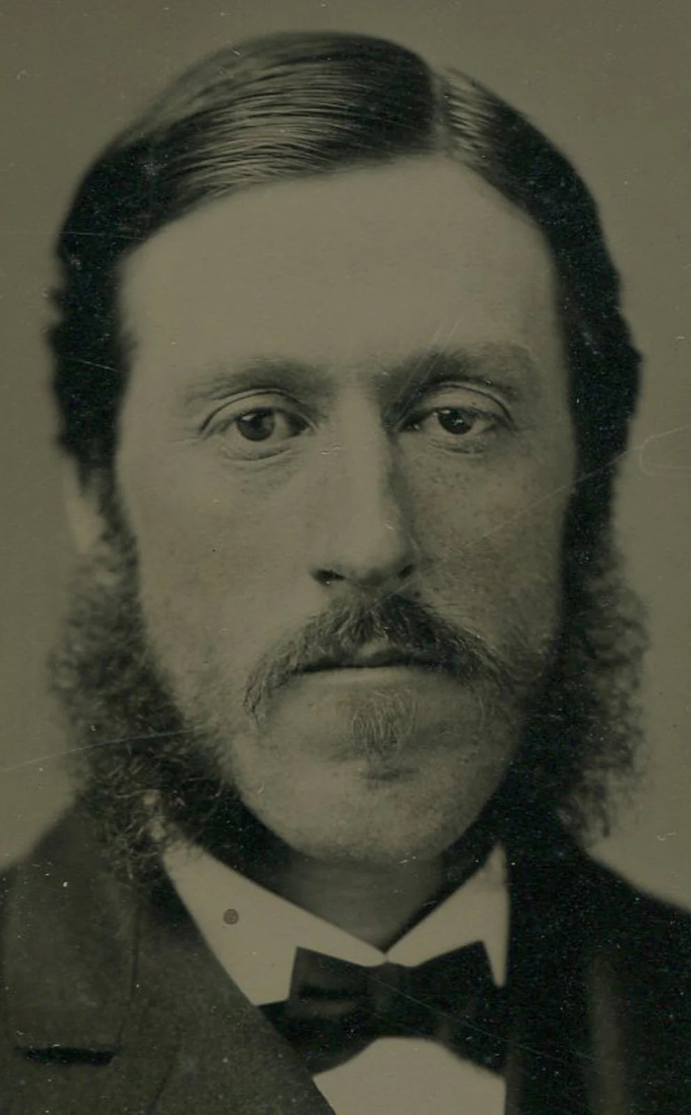 LONG FACED MAN, PENSIVE EXPRESSION, MUTTON CHOPS. TINTED FULL PLATE TINTYPE.