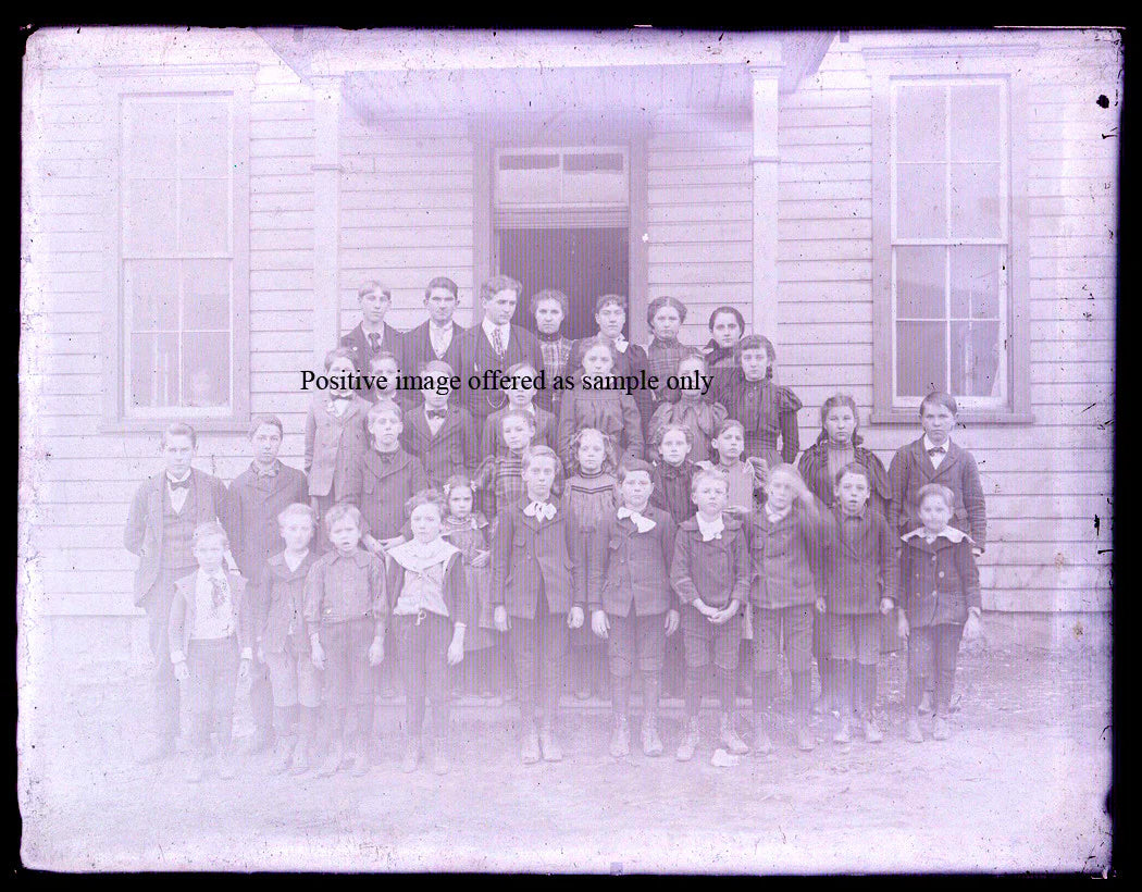 STUDENT PHOTO, ONE ROOM SCHOOLHOUSE. GLASS PLATE NEGATIVE, 8.5 X 6.5 INCHES.