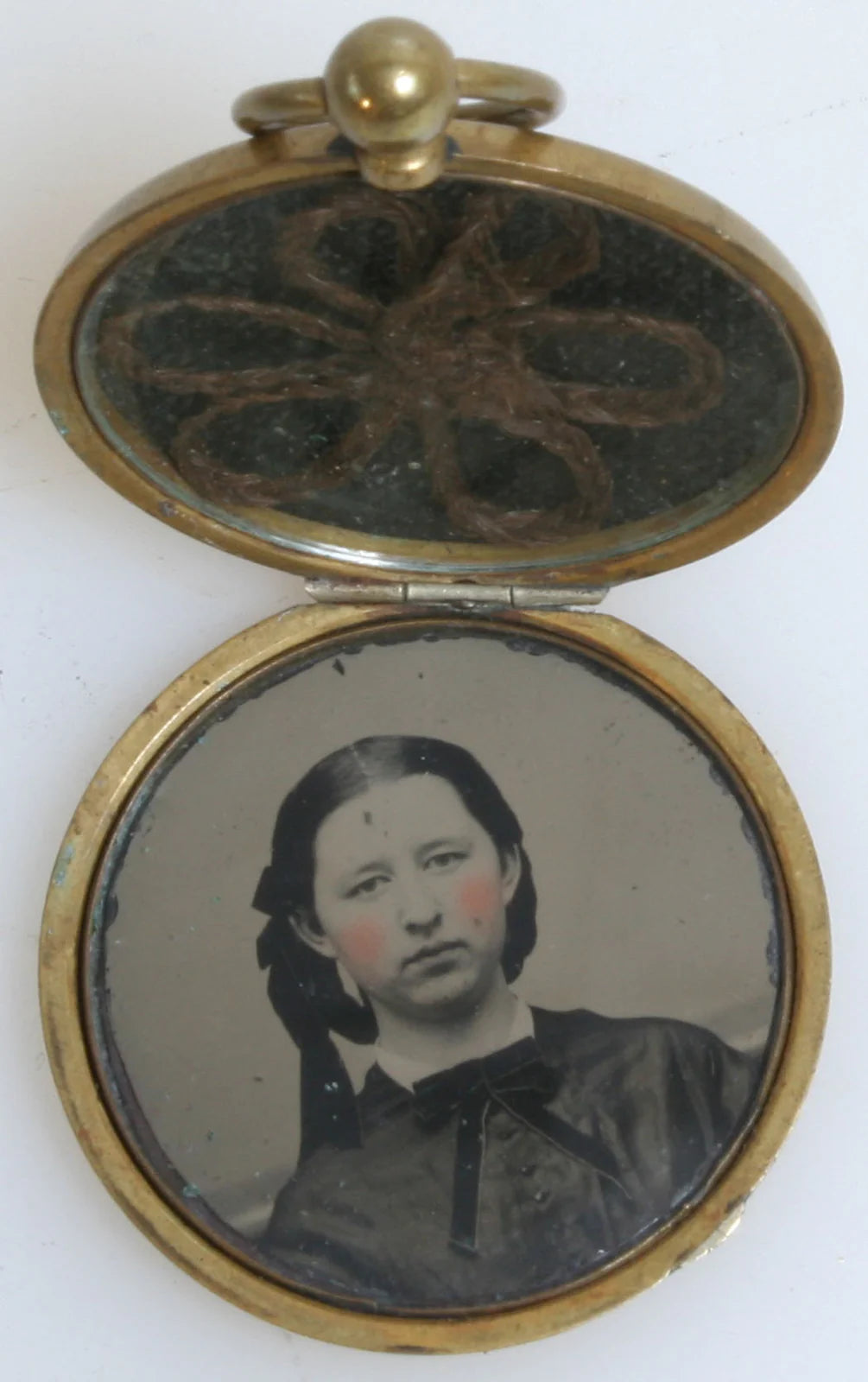YOUNG GIRL IN BRAIDED HAIR. LOCKET JEWELRY, TINTED TINTYPE WITH LOCKET OF BRAID.