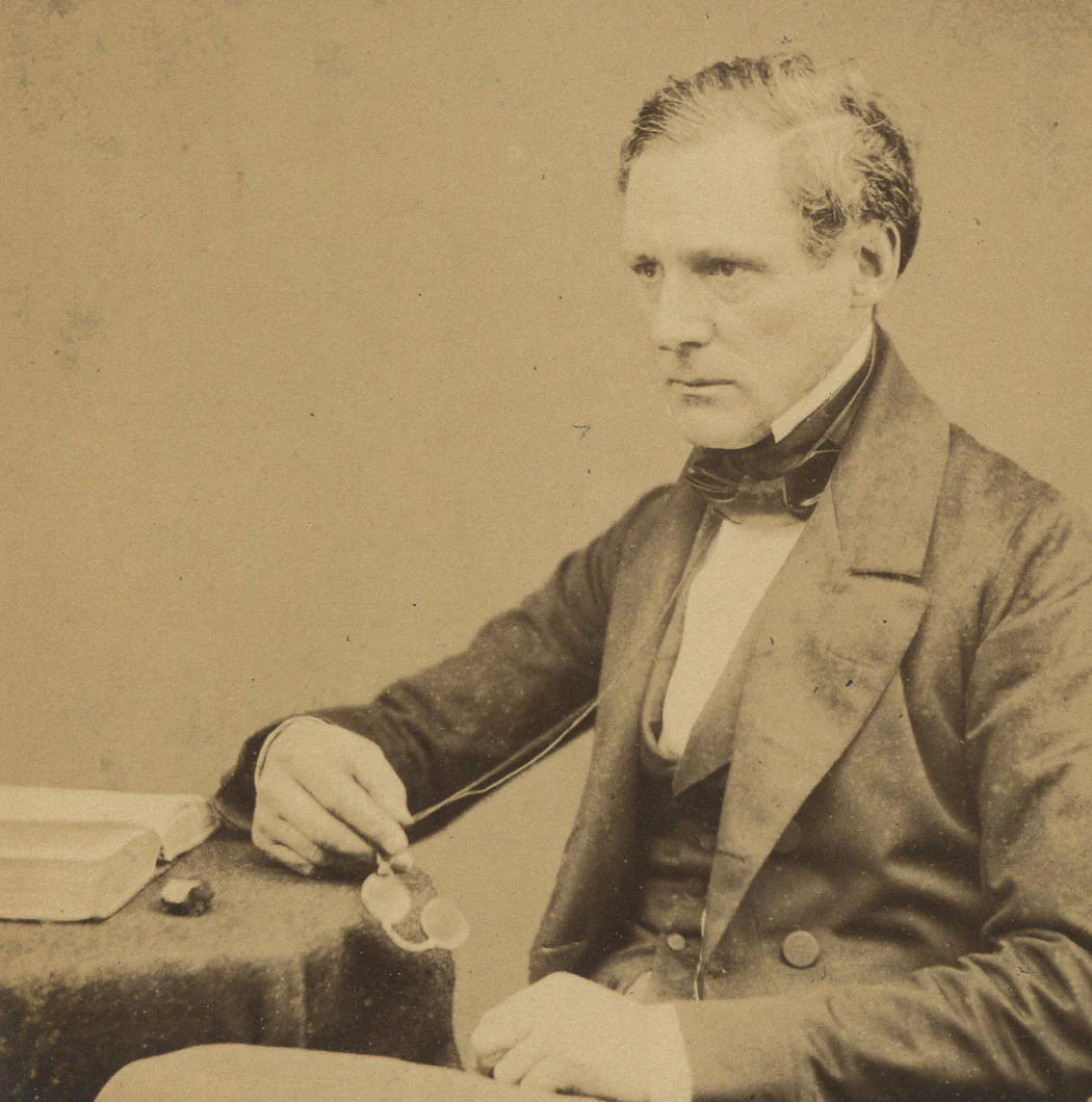 MAN SEATED HOLDING GLASSES. ALBUMEN BY MAUL AND POLYBLANK.