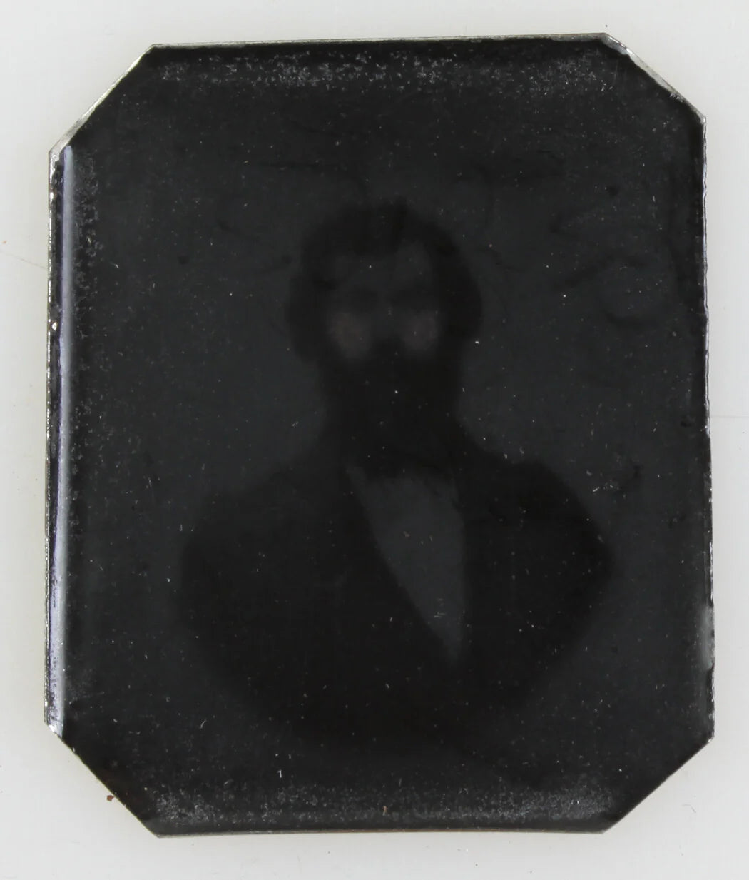 GHOST LIKE MALE IMAGE ON METAL.