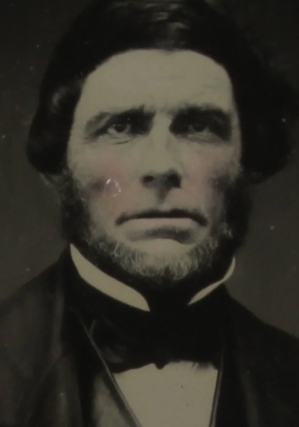 RUGGEDLY HANDSOME MAN. CRISP TINTED 6TH PLATE AMBROTYPE, FULL CASE.