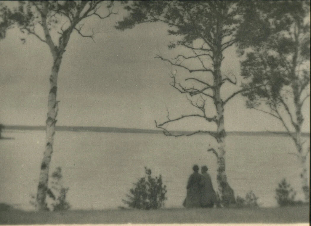 PHOTO PICTORIAL, LANDSCAPE AND WOMAN AT WATERS EDGE. 11 X 14 INCH SILVER PRINT.