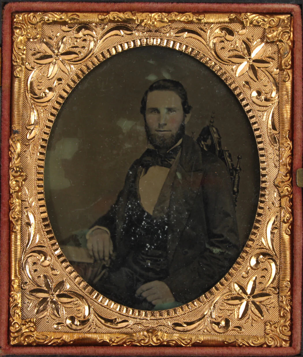 BEARDED MAN SEATED WITH BOOK. 6TH PLATE AMBROTYPE, FULL UNION CASE.