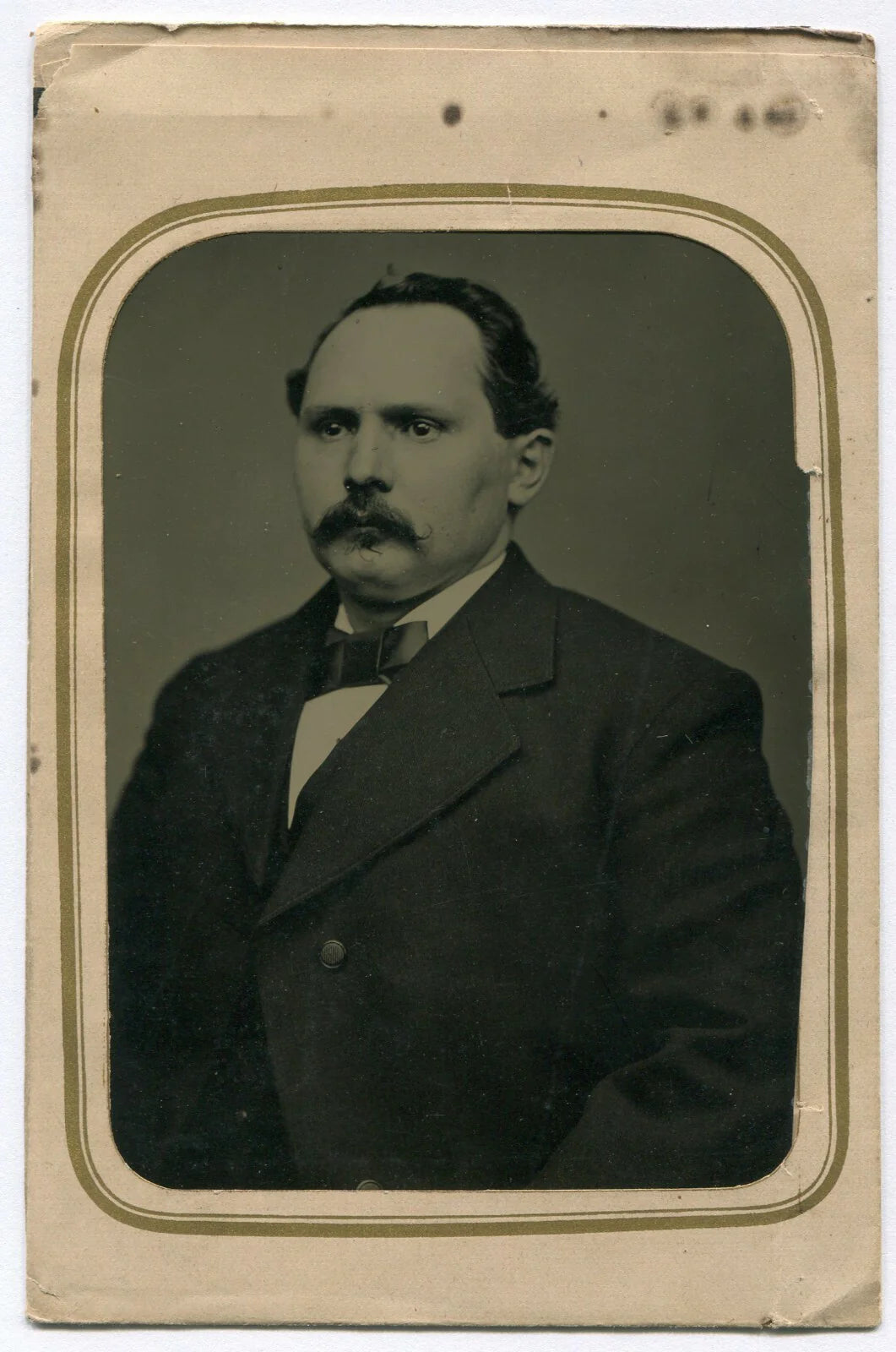 STOIC MAN, MUSTACHE, AND RECEDING HAIRLINE. CRISP TINTYPE IN PAPER MAT, 4 X 6 IN