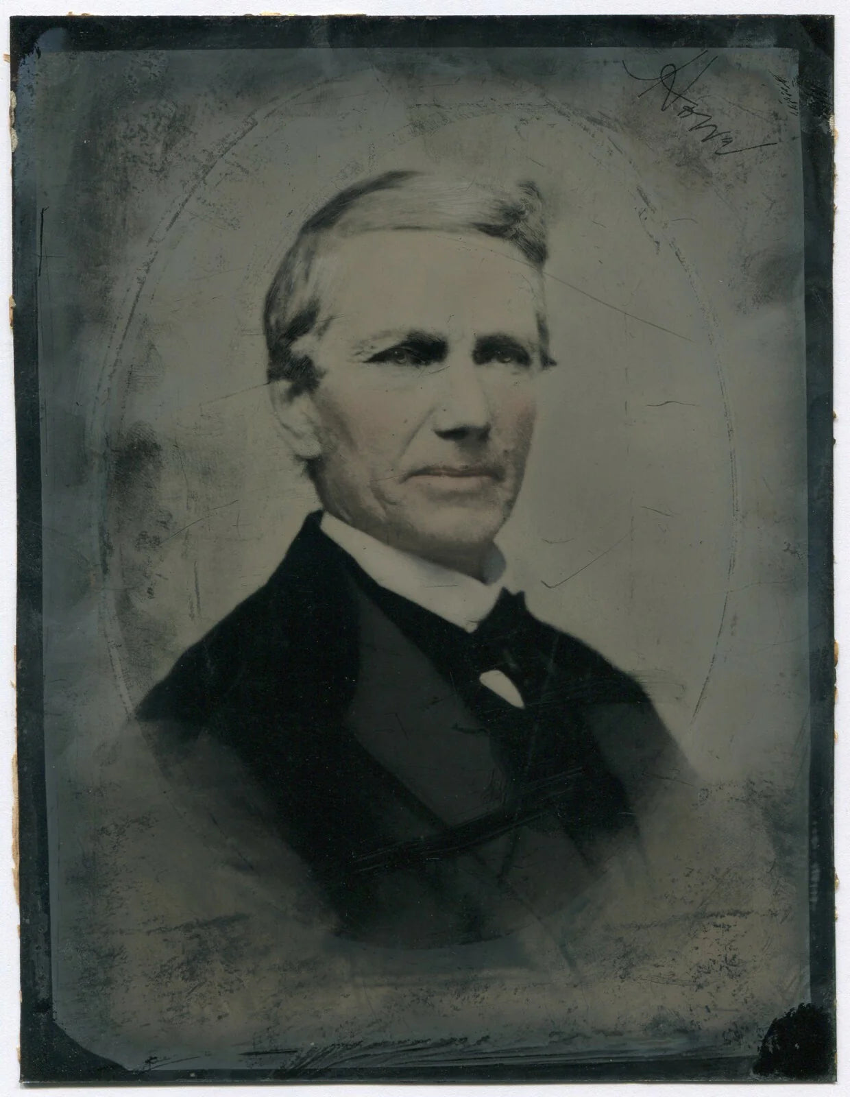 MAN W/DEEP SET EYES. TINTED TINTYPE 8.5X6.5 IN.