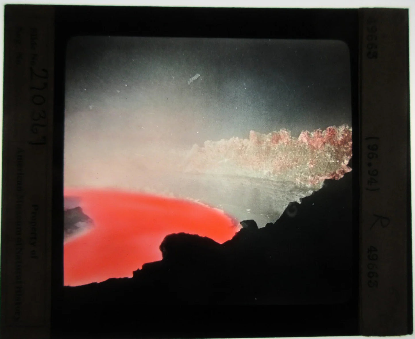 LAVA PIT, HALEMAUMAU, 1919. HAND COLORED PHOTO ON GLASS.