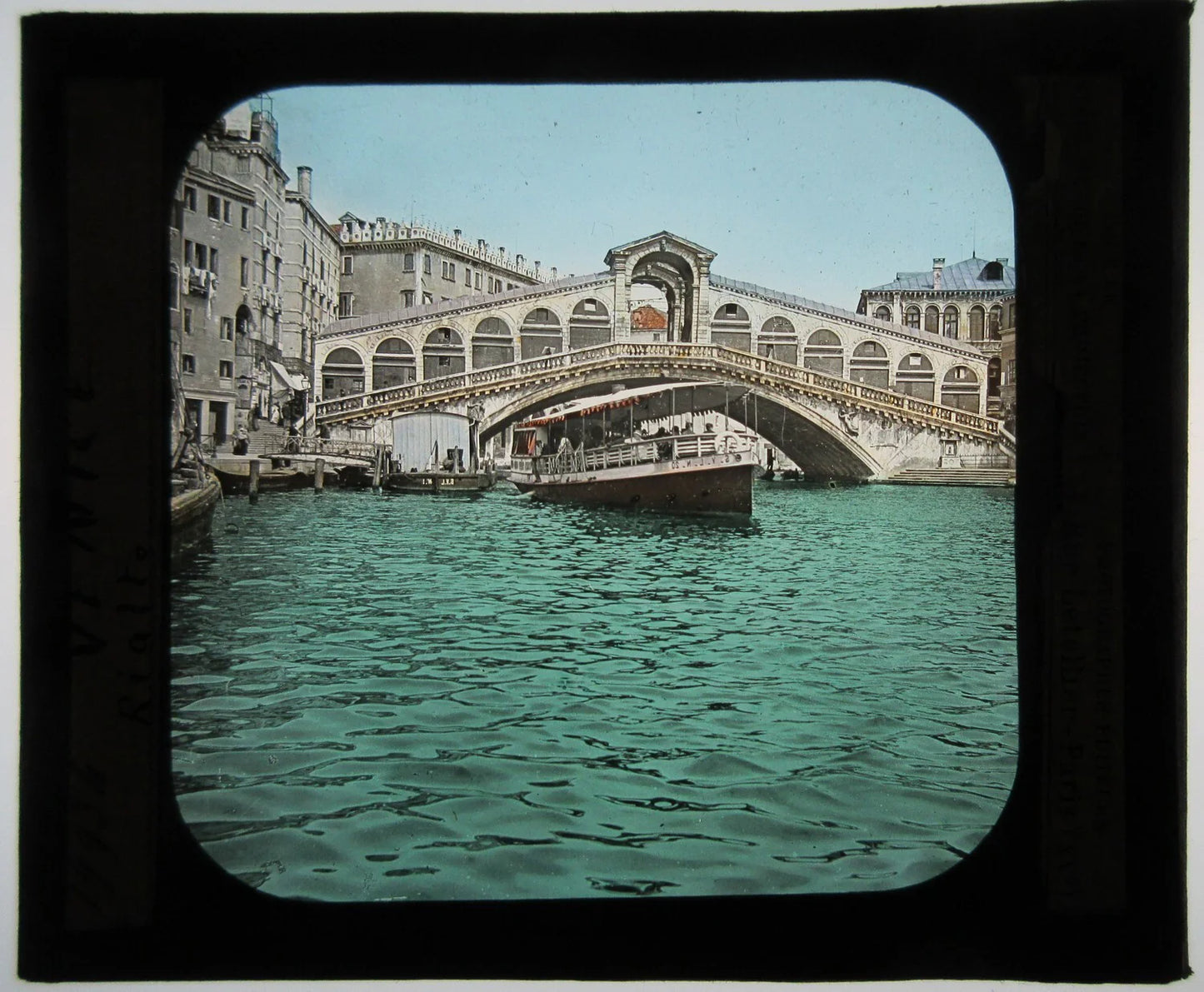 RIALTO BRIDGE, VENICE, ITALY. HAND COLORED PHOTO ON GLASS.