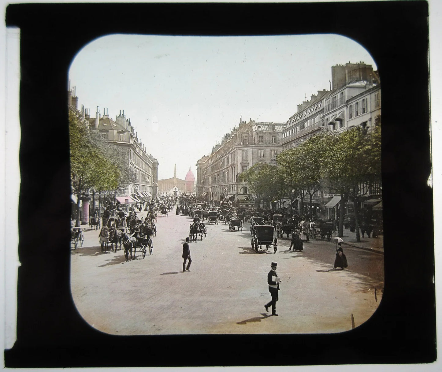 STREET SCENE W/PARIS OPERA. HAND COLORED PHOTO ON GLASS.
