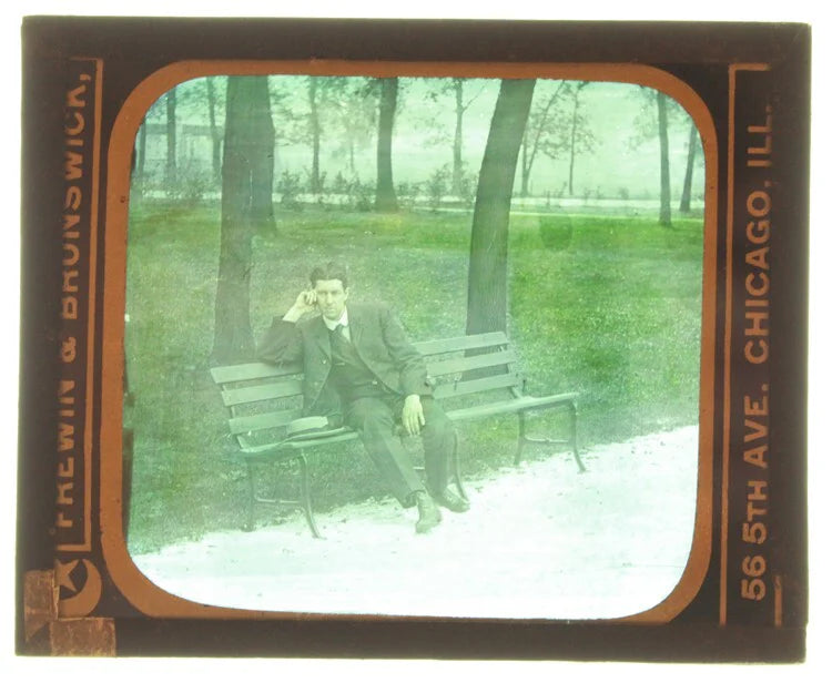 AUTOCHROME OF YOUNG MAN POSING ON PARK BENCH